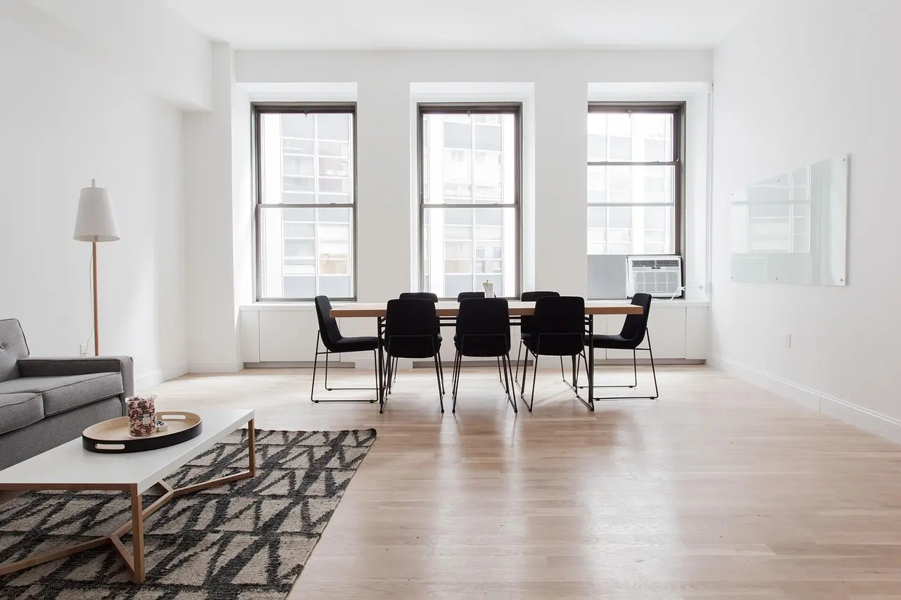 Bright dining room with hardwood floors, prepared for listing photos